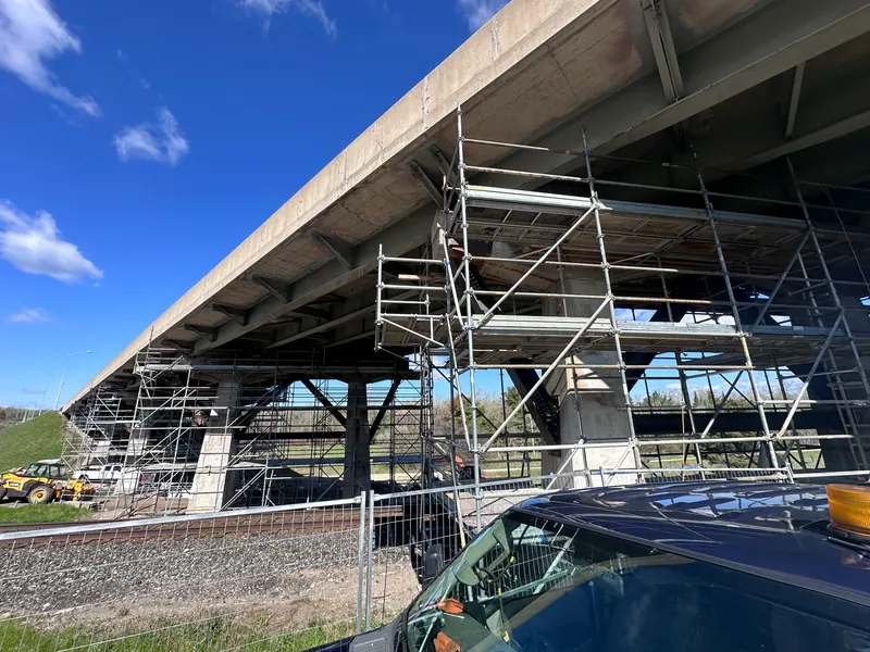 Bridge structure with access scaffolding for reinforcement work