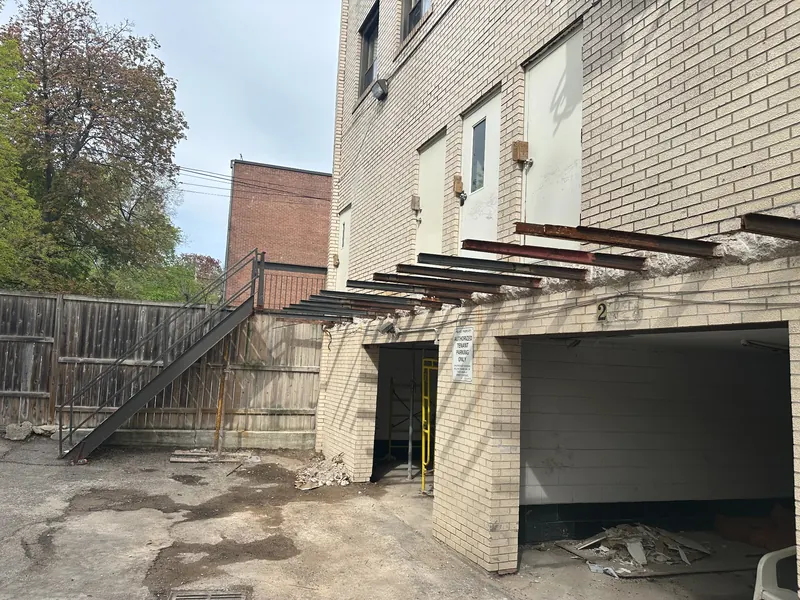 Steel reinforcement members extending from a commercial building exterior