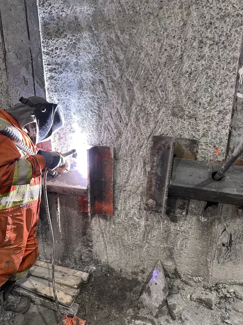 Riconstruct welder working on a steel connection
